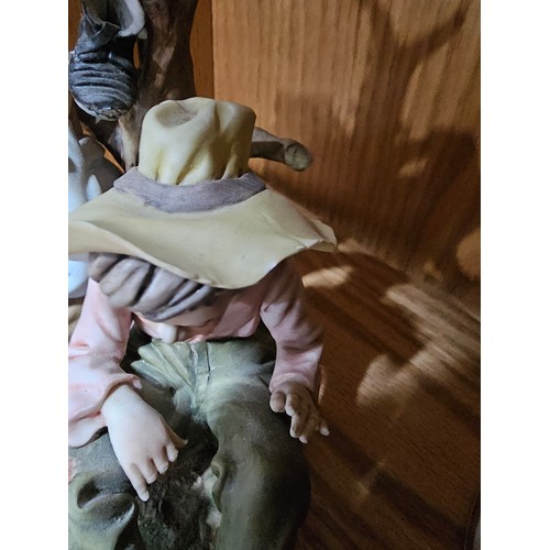 109 - A collection of 3 Capodimonte figurines to include a craftsman along with a tramp on a park bench an... 