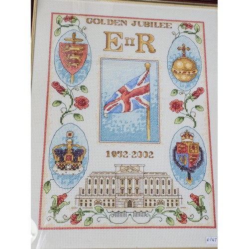 93 - A collection of military and royal related items to include a framed and glazed regimental cap badge... 