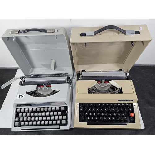 96 - A pair of vintage cased typewriters to include a Maritso 30 type typewriter along with a Silverreed ... 