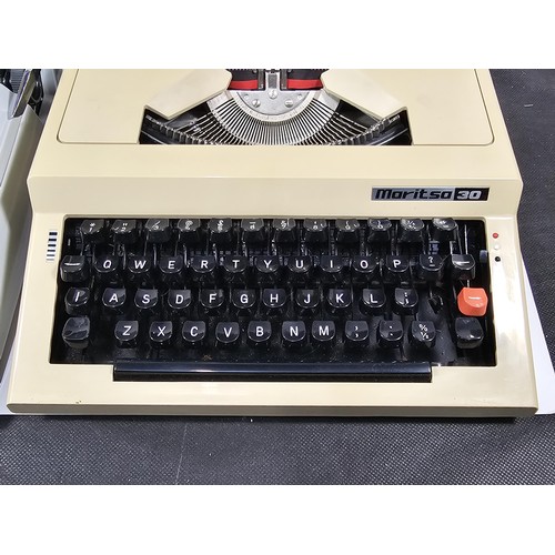 96 - A pair of vintage cased typewriters to include a Maritso 30 type typewriter along with a Silverreed ... 