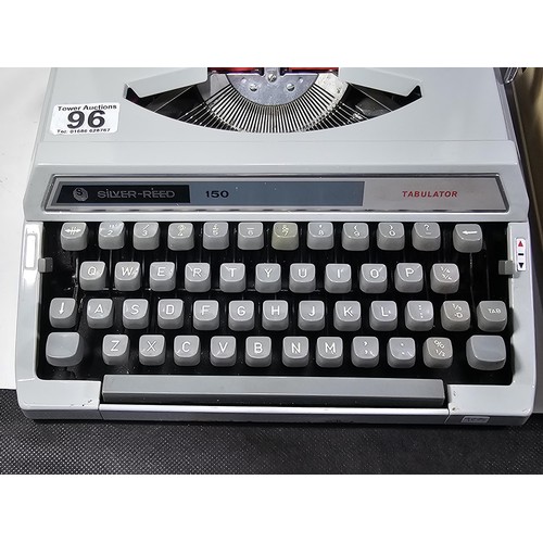 96 - A pair of vintage cased typewriters to include a Maritso 30 type typewriter along with a Silverreed ... 