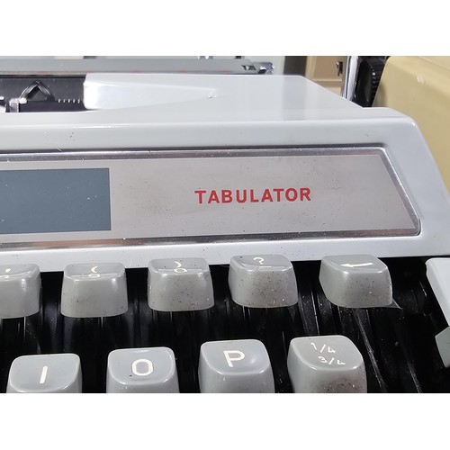 96 - A pair of vintage cased typewriters to include a Maritso 30 type typewriter along with a Silverreed ... 