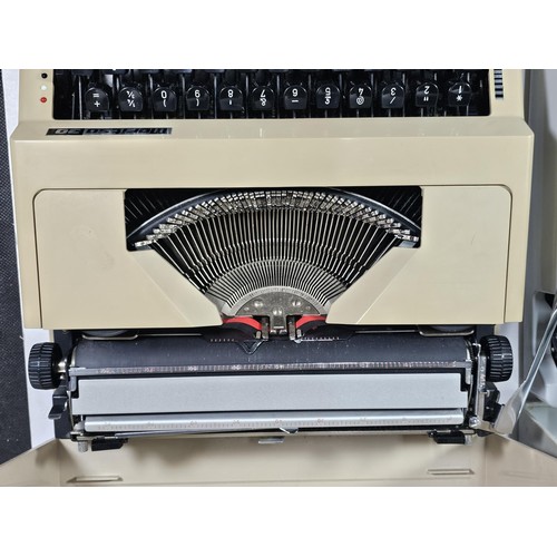 96 - A pair of vintage cased typewriters to include a Maritso 30 type typewriter along with a Silverreed ... 