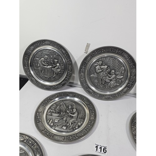 116 - A collection of 8x tin plates each with a different trade design to the front to include Glassblower... 