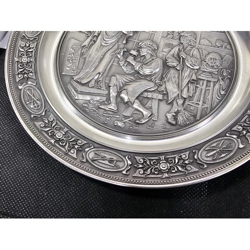 116 - A collection of 8x tin plates each with a different trade design to the front to include Glassblower... 