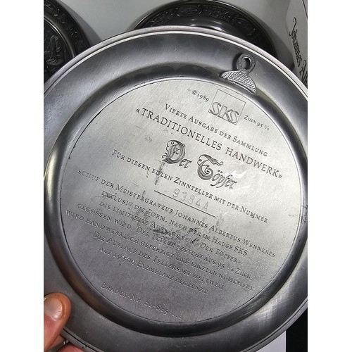 116 - A collection of 8x tin plates each with a different trade design to the front to include Glassblower... 