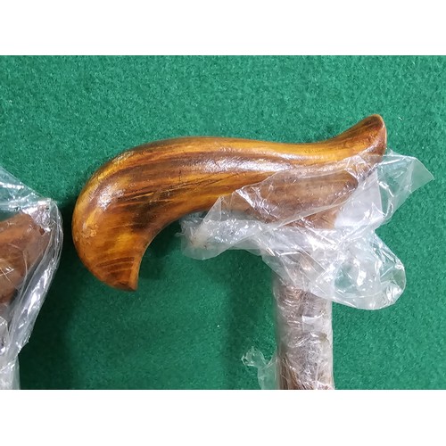 120 - A collection of 4x good quality as new walking sticks to include two with brass handles and 2x with ... 