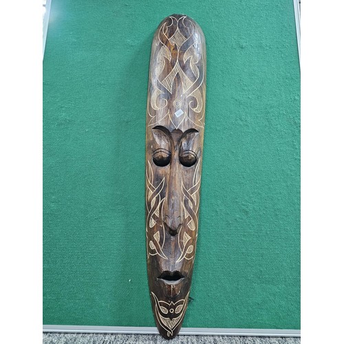 123 - A good quality hand carved wooden wall hanging face mask with engraving to the front all in good ord... 