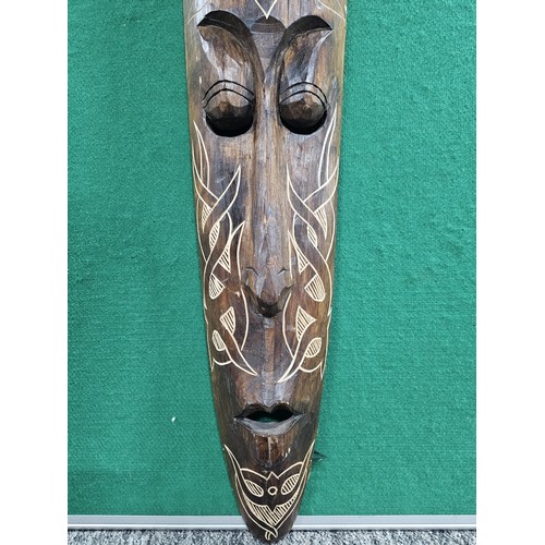 123 - A good quality hand carved wooden wall hanging face mask with engraving to the front all in good ord... 