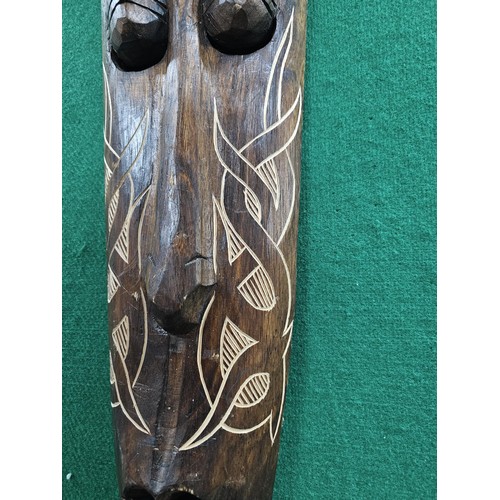123 - A good quality hand carved wooden wall hanging face mask with engraving to the front all in good ord... 