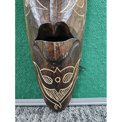 123 - A good quality hand carved wooden wall hanging face mask with engraving to the front all in good ord... 