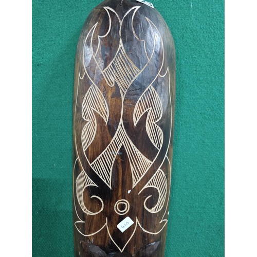 123 - A good quality hand carved wooden wall hanging face mask with engraving to the front all in good ord... 