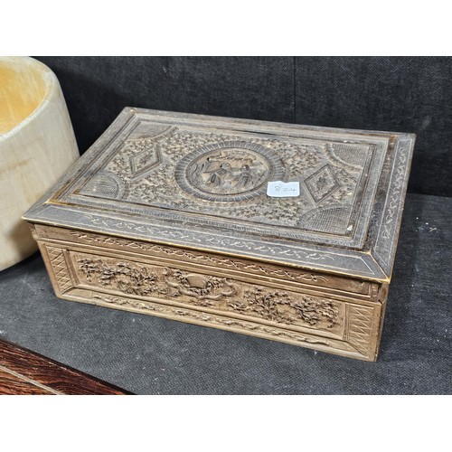 125 - A collection of wooden items to include a hand carved lidded box displaying an image of two people i... 