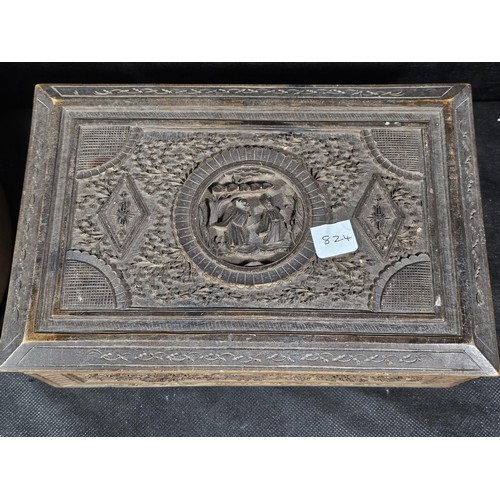125 - A collection of wooden items to include a hand carved lidded box displaying an image of two people i... 