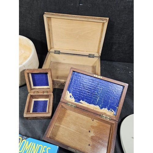 125 - A collection of wooden items to include a hand carved lidded box displaying an image of two people i... 