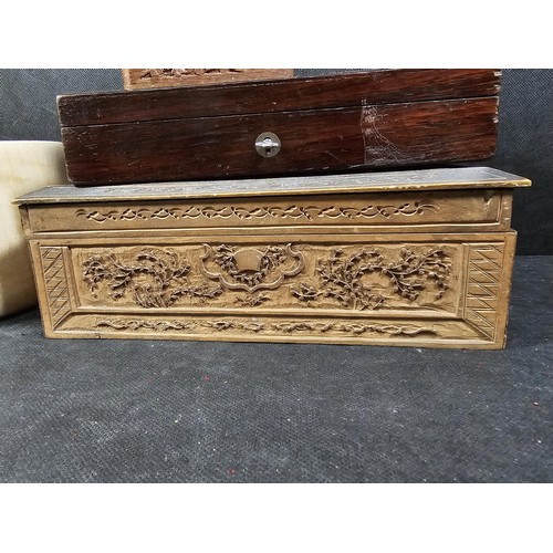 125 - A collection of wooden items to include a hand carved lidded box displaying an image of two people i... 