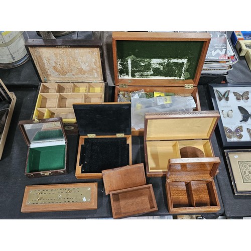 131 - A collection of trinket boxes to include a large light oak lidded box containing a quantity of brass... 