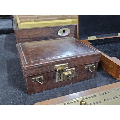 131 - A collection of trinket boxes to include a large light oak lidded box containing a quantity of brass... 