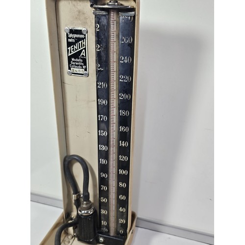 132 - A vintage Zenith A blood pressure monitor kit, appears to be complete with armband and pump, along w... 