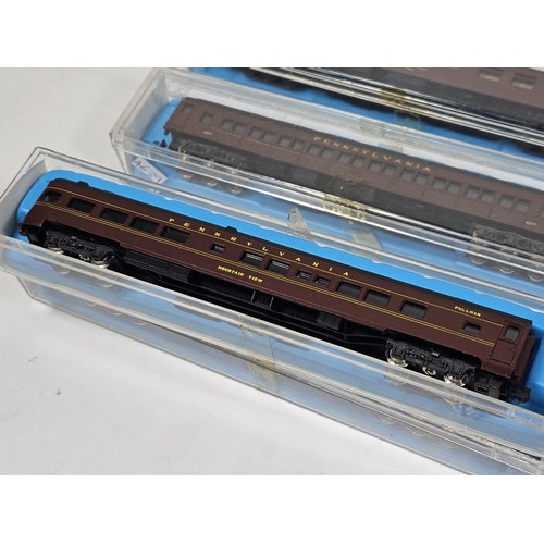 138 - A collection of eight N gauge model railway carriages all relating to the Pennsylvania line, to incl... 