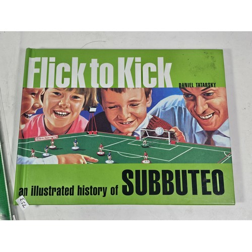 143 - A Flick to Kick history of Subbuteo book along with Subbuteo wrapping paper and matching gift bag, a... 