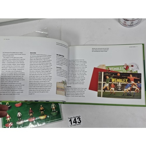 143 - A Flick to Kick history of Subbuteo book along with Subbuteo wrapping paper and matching gift bag, a... 