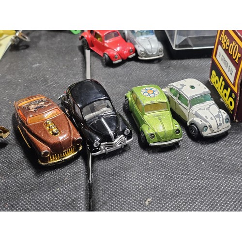 149 - A collection of diecast cars to include 6 cars in perspex cases, a Ferrari, Mini, Fiat Punto rally c... 