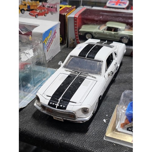 149 - A collection of diecast cars to include 6 cars in perspex cases, a Ferrari, Mini, Fiat Punto rally c... 