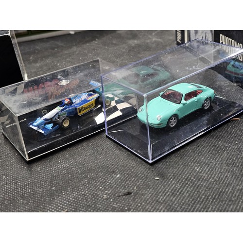 149 - A collection of diecast cars to include 6 cars in perspex cases, a Ferrari, Mini, Fiat Punto rally c... 
