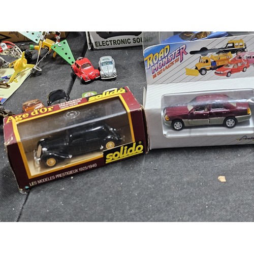 149 - A collection of diecast cars to include 6 cars in perspex cases, a Ferrari, Mini, Fiat Punto rally c... 