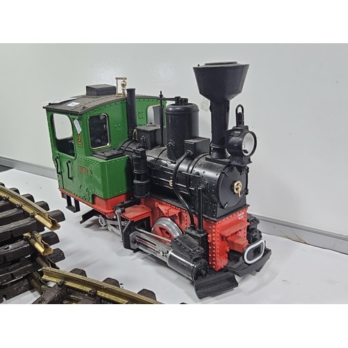 151 - A good quality heavy locomotive with a quantity of track, removed from a shop, used to travel around... 