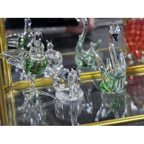 154 - 5x glass and metal small display cases to include 2x hexagonal shelf cases with three shelves contai... 