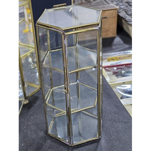 154 - 5x glass and metal small display cases to include 2x hexagonal shelf cases with three shelves contai... 