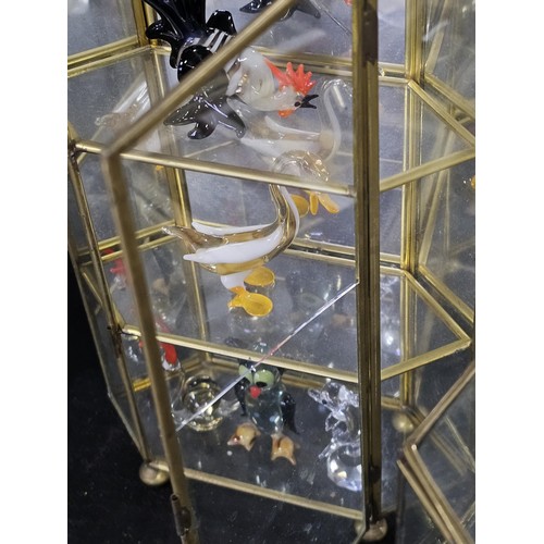 154 - 5x glass and metal small display cases to include 2x hexagonal shelf cases with three shelves contai... 