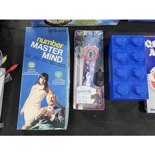 134 - A quantity of games to include numbers Mastermind, 2x diecast cars a plated Queen Anne plate, a boxe... 