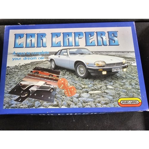 134 - A quantity of games to include numbers Mastermind, 2x diecast cars a plated Queen Anne plate, a boxe... 