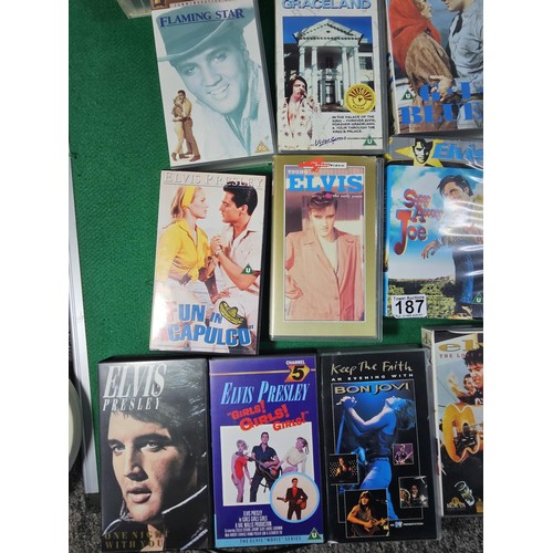187 - A box containing a large quantity of 42x Elvis related VHS tapes to include Fun in Acapulco, Evis Co... 
