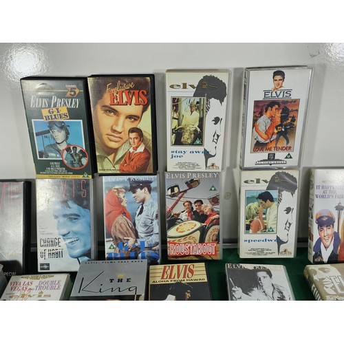 187 - A box containing a large quantity of 42x Elvis related VHS tapes to include Fun in Acapulco, Evis Co... 