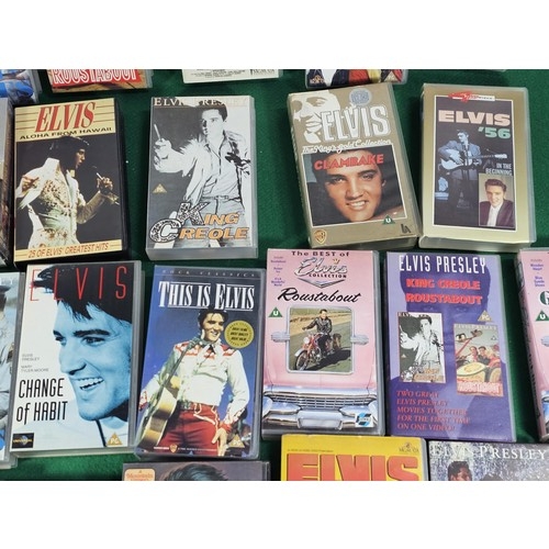 187 - A box containing a large quantity of 42x Elvis related VHS tapes to include Fun in Acapulco, Evis Co... 