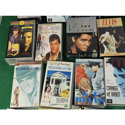 187 - A box containing a large quantity of 42x Elvis related VHS tapes to include Fun in Acapulco, Evis Co... 
