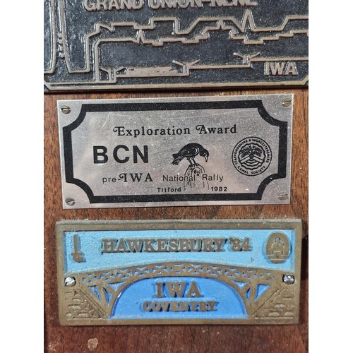 211 - An International Waterways Association (IWA) Commemorative plaque display, mounted on a hardwood boa... 