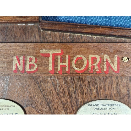 211 - An International Waterways Association (IWA) Commemorative plaque display, mounted on a hardwood boa... 