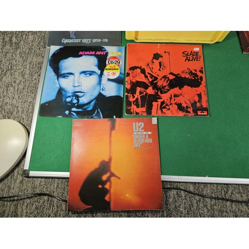 195 - Crate containing a quantity of assorted LP's of various genre to include U2, Adam Ant, Slade, ABBA, ... 