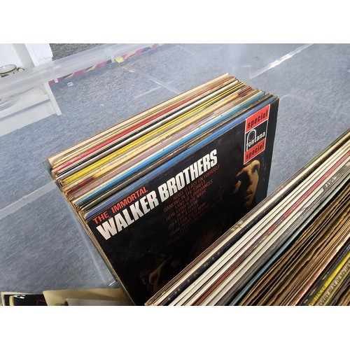 196 - Large crate containing a large quantity of Lp's and 45's of various genre and artists to include Pau... 