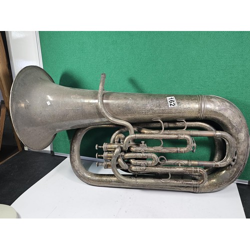 162 - A vintage Class A three valve silver plated Tuba by Boosey & Co, London, has a clear makers stam... 