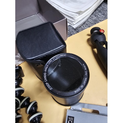 165 - A large quantity of photographic related items to include a Cannon EOS 600 camera along with and ass... 