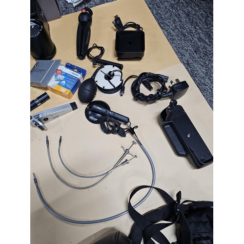 165 - A large quantity of photographic related items to include a Cannon EOS 600 camera along with and ass... 