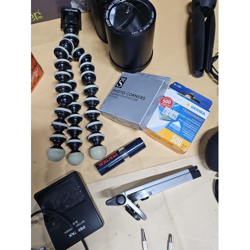 165 - A large quantity of photographic related items to include a Cannon EOS 600 camera along with and ass... 