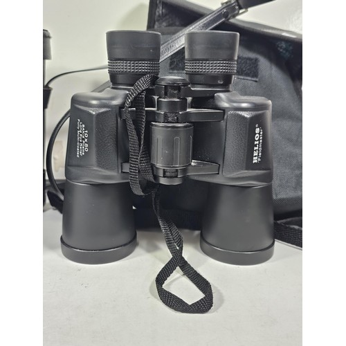 168 - A collection of 3x cased binoculars to include a cased pair of Helios 10x50 binoculars, a pair of Pr... 