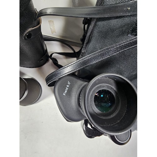 168 - A collection of 3x cased binoculars to include a cased pair of Helios 10x50 binoculars, a pair of Pr... 